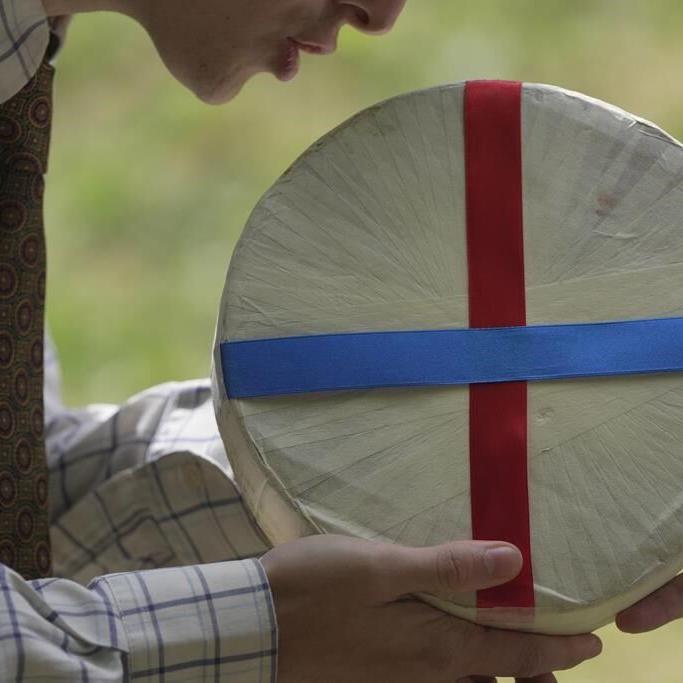 Rolling thunder: Contestants chase cheese wheel down a hill in chaotic UK race